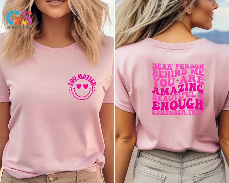 May include: Pink t-shirt with a pink smiley face with hearts for eyes and the text "You Matter" on the front. The back of the shirt has the text "Dear person behind me you are amazing beautiful enough remember that" in pink.