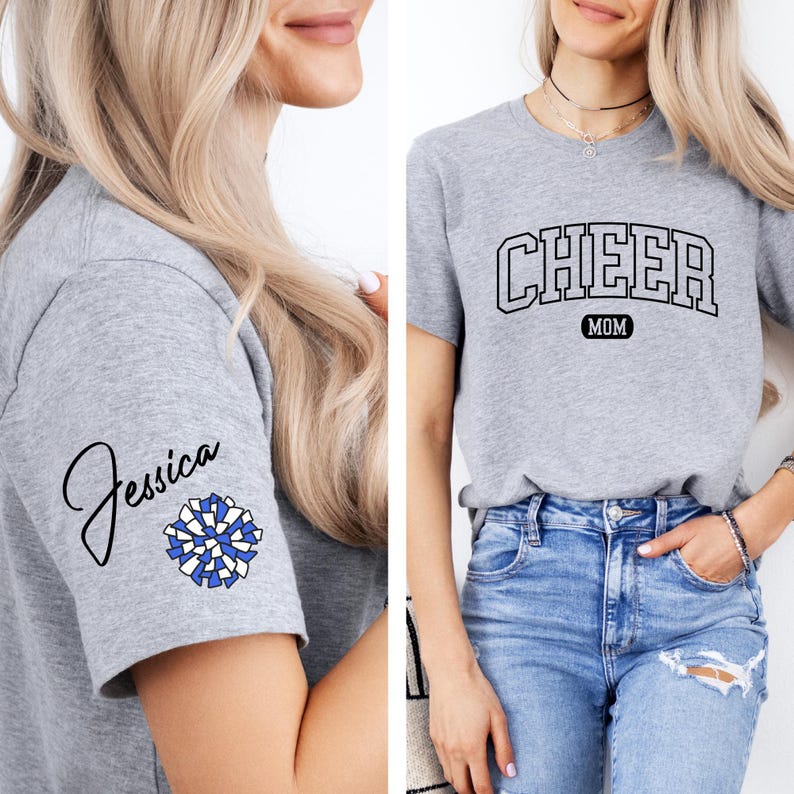 May include: Gray t-shirt with the text "CHEER MOM" in a black arched font. The shirt also features a blue and white pom-pom on the sleeve with the name "Jessica" written in cursive.