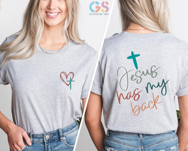May include: Gray t-shirt with a heart and cross on the front and the text "Jesus has my back" with a cross on the back.