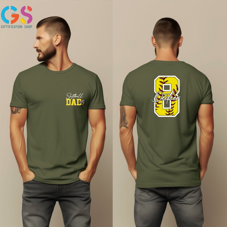 May include: A green t-shirt with the text "Softball Dad" on the front and a yellow softball with the number 8 and the text "Dad" on the back.