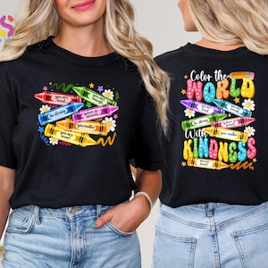 May include: Black t-shirt with a colorful crayon design and the text "Color the World with Kindness". The crayons have positive messages written on them, such as "You are loved", "Be strong", and "You matter".