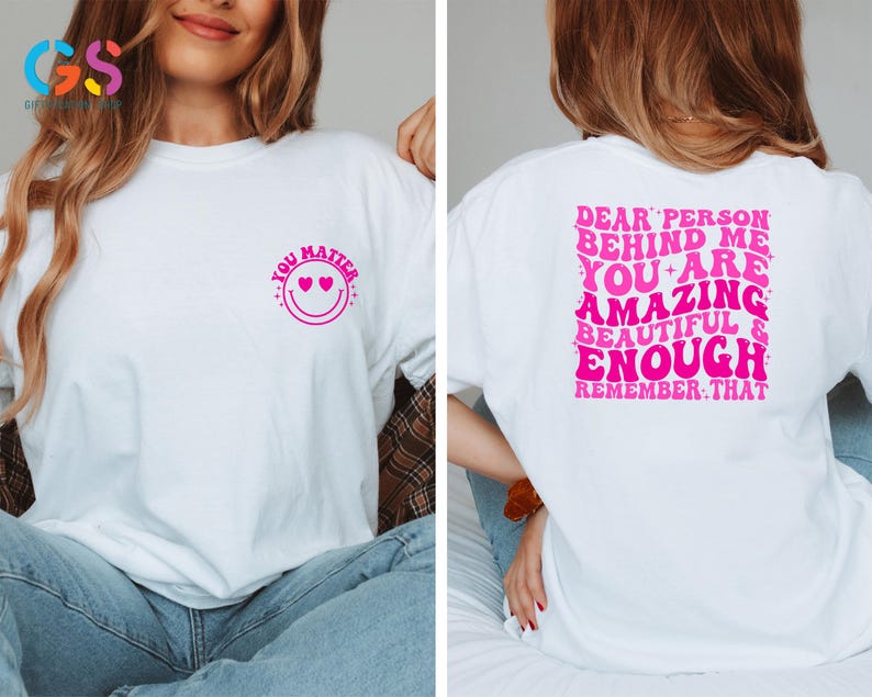 May include: White t-shirt with a pink smiley face with hearts for eyes and the text "You Matter" on the front. The back of the shirt has the text "Dear person behind me, you are amazing, beautiful & enough. Remember that." in pink.