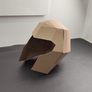 Superhero helmet or villain helmet cardboard craft template on the table