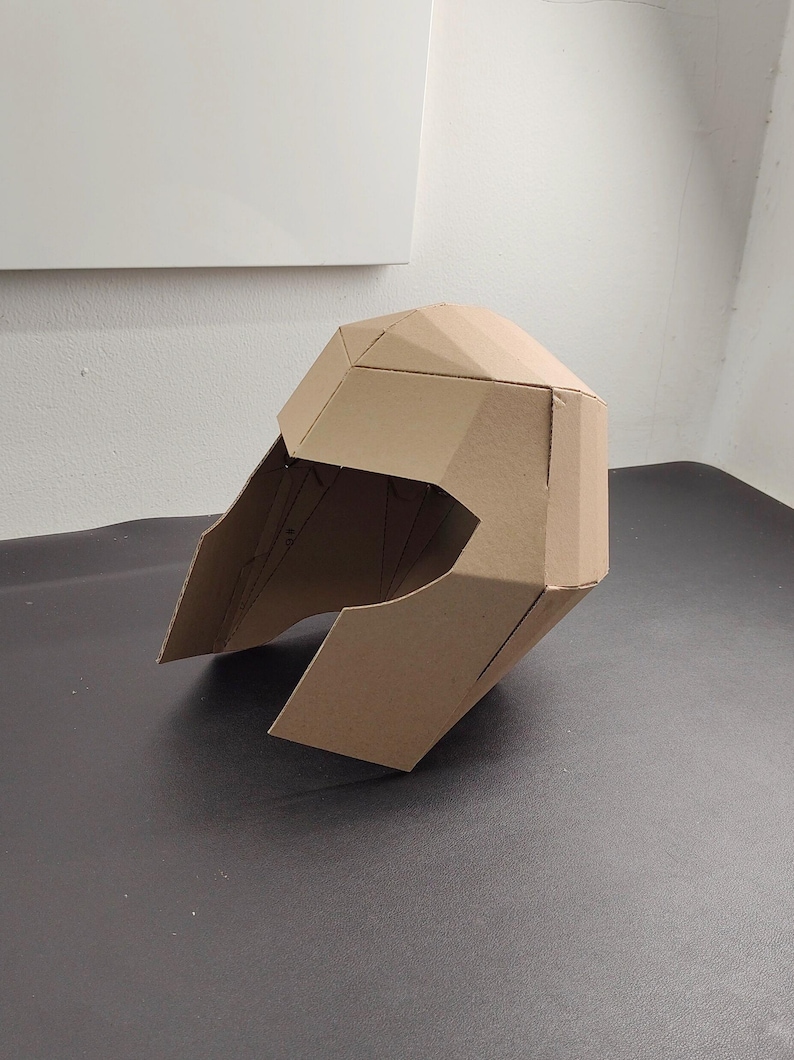 Superhero helmet or villain helmet cardboard craft template on the table