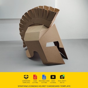 May include: A brown cardboard Spartan helmet with a tall crest, featuring geometric panels and a nose guard. Below the helmet, a yellow banner displays icons for cardboard templates, PDF, SVG, video tutorial, and the text SPARTAN/LEONIDAS HELMET CARDBOARD TEMPLATE.