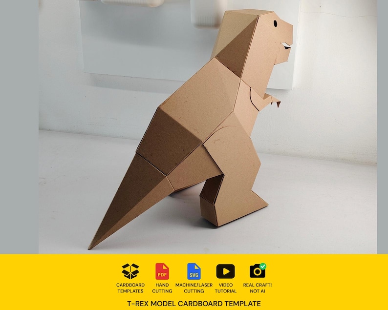 May include: A brown cardboard T-Rex model featuring geometric panels. Below the model, text reads: CARDBOARD TEMPLATES, PDF, HAND CUTTING, SVG, MACHINE/LASER CUTTING, VIDEO TUTORIAL, REAL CRAFT! NOT AI, and T-REX MODEL CARDBOARD TEMPLATE.