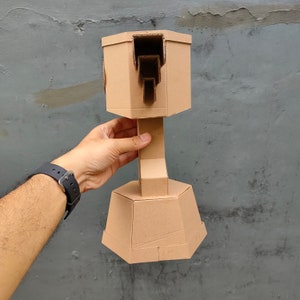 Cardboard Trophy Cup for Racing with a piston and wings side view