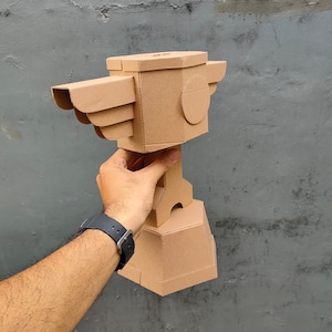 Cardboard Trophy Cup for Racing with a piston and wings front-right view