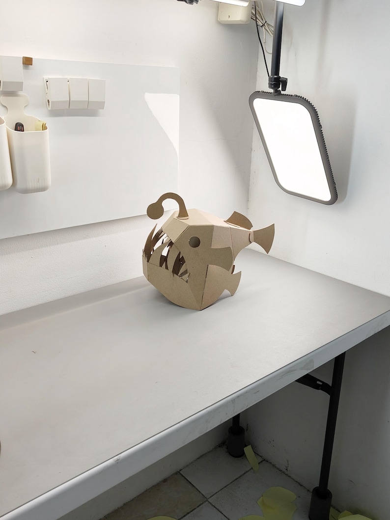 Cardboard Angler Fish Full Head Mask on the table