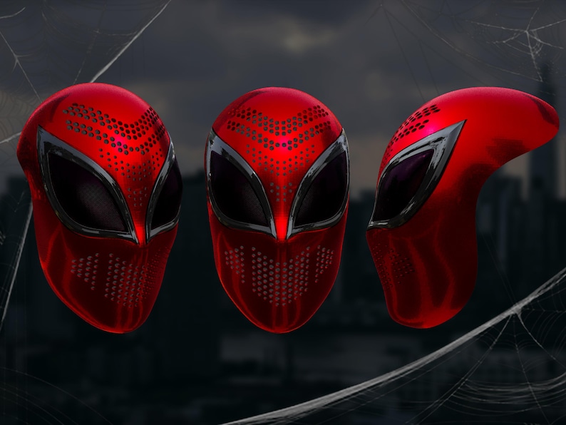 May include: Three red superhero masks with black eye coverings and a perforated pattern. The masks have a metallic sheen and are displayed against a blurred cityscape background.