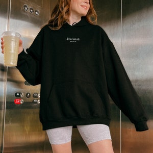 May include: Black hooded sweatshirt with the text "Jeremiah 29:11" in white lettering.