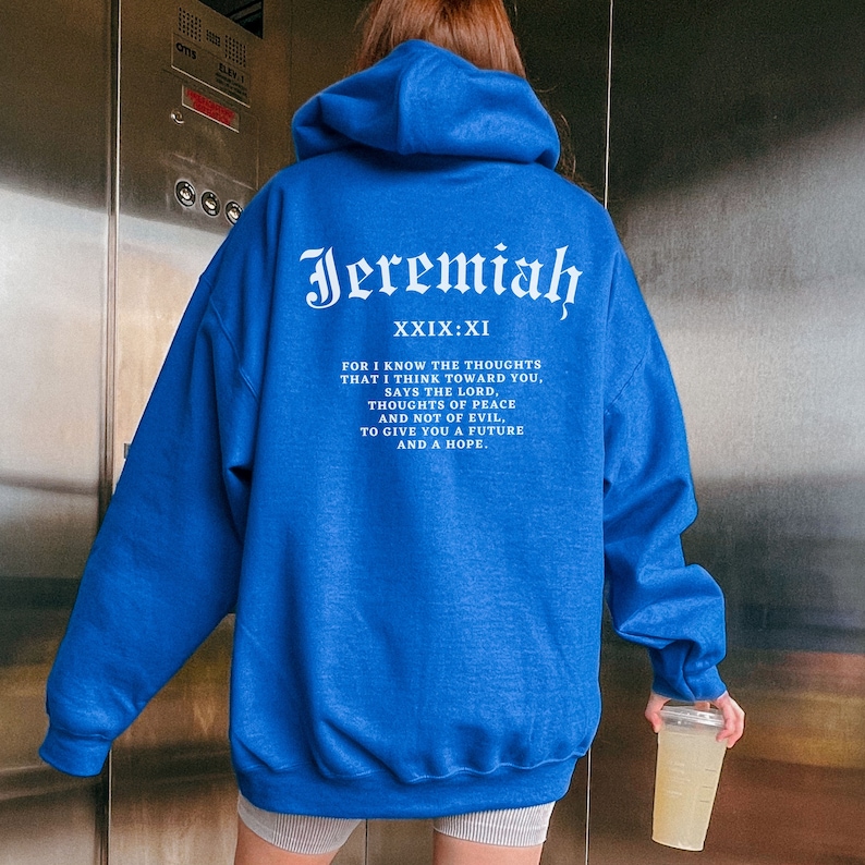 May include: A royal blue hoodie with a white print that reads "Jeremiah XXIX:XI" and a bible verse about peace and hope.