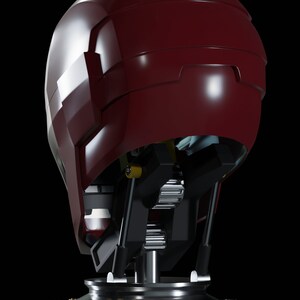 May include: A red and silver robot head with a detailed mechanical neck and base. The head is on a black background.
