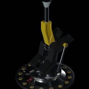 May include: A black and yellow gear shifter with a chrome base and a black knob. The base has a ring of yellow buttons around the edge.