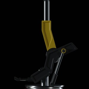 May include: A black and yellow metal joystick with a round base and a lever that can be moved in multiple directions.