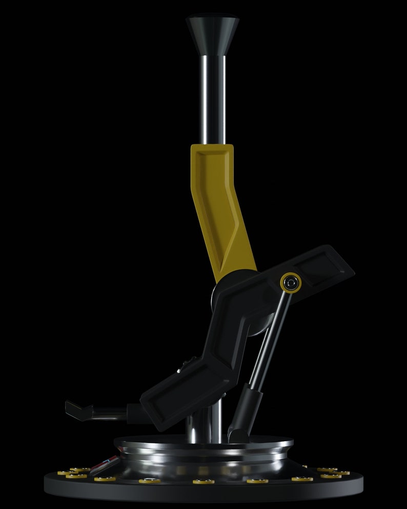 May include: A black and yellow metal joystick with a round base and a lever that can be moved in multiple directions.