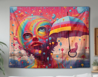 May include: A wall tapestry featuring a vibrant, multi-coloured illustration of a face with swirling patterns, looking upward under a striped umbrella. The scene is filled with colourful, dripping paint-like droplets against a bright pink background.