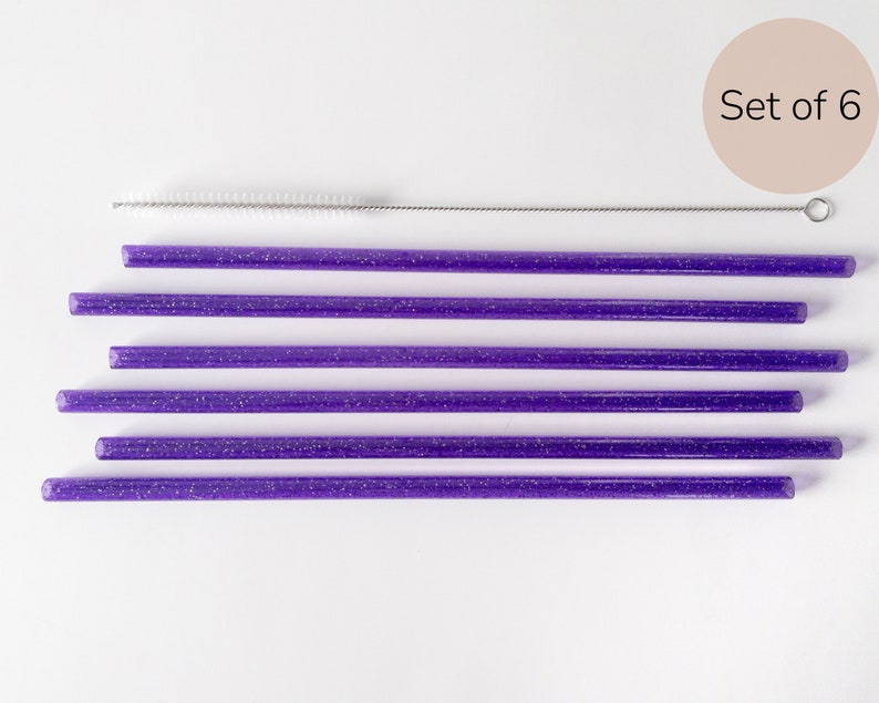 May include: Set of six purple glitter reusable drinking straws with a cleaning brush. Set of 6.