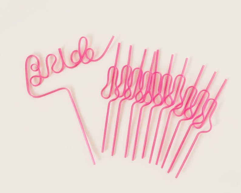 Hot pink bachelorette party straw set with reusable swirly drink straws for bridal shower and girls trip favors