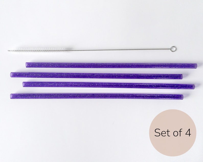 May include: Set of four purple glitter reusable drinking straws with a cleaning brush. Set of 4.