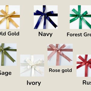 May include: A collection of gift boxes, each adorned with a satin ribbon bow in various colors. Colors include old gold, navy, forest green, sage, ivory, rose gold, and rust. Each box has the color name printed below it.