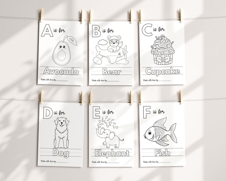 May include: Black and white printable alphabet flashcards with illustrations for each letter. The letters A through F are shown with the corresponding word below each letter. The illustrations include an avocado, bear, cupcake, dog, elephant, and fish.