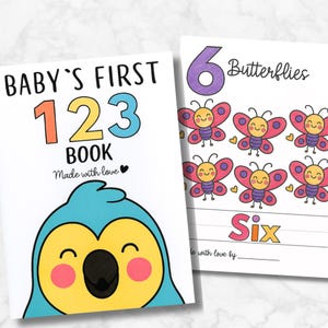 May include: Two children's books. The first book cover says "BABY'S FIRST 123 BOOK" with a cartoon bird illustration. The second book shows six cartoon butterflies and the word "Six". Both books are white with colorful illustrations.