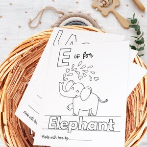 May include: Black and white printable alphabet flashcard featuring the letter E and an illustration of an elephant. The text "E is for Elephant" is written below the image. The card is designed for children to learn the alphabet and practice writing.