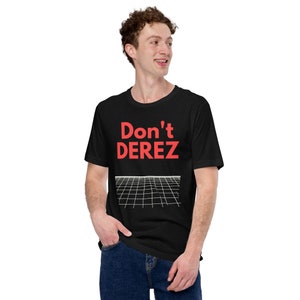 May include: A black t-shirt with a red graphic that says "Don't Derez" and a white grid pattern underneath.