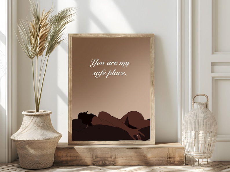 May include: A digital art print with a brown background and a silhouette of a person lying down. The text "You are my safe place." is written in white on the print.