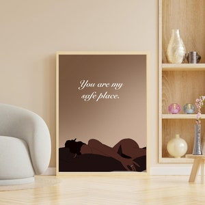 May include: A framed illustration of a person lying down with the text "You are my safe place." The illustration is on a brown background with a light brown frame.