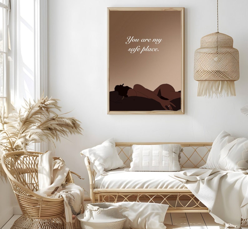 May include: A minimalist art print with a brown background and a silhouette of a person lying down. The text "You are my safe place." is printed in white on the print.