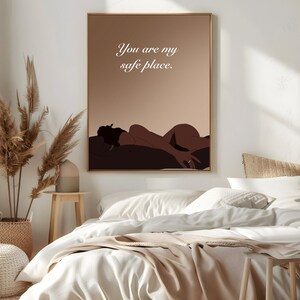 May include: A digital art print with a brown background and a silhouette of a person lying down. The text "You are my safe place." is written in white on the print.