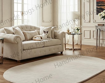 Luxe Ivory Oval Wool Rug: Hand-Tufted, Modern Elegance
