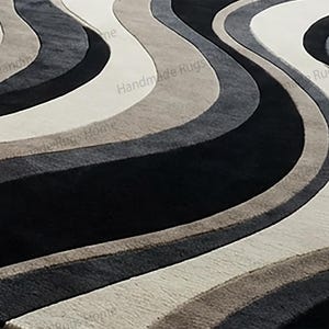 Luxury handcrafted area rug with flowing stripe motif,

Neutral dramatic rug complementing chic furniture setting