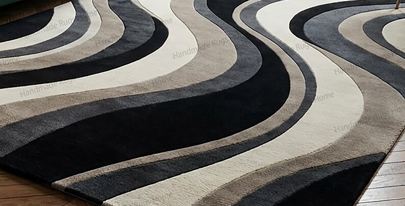 Luxury handcrafted area rug with flowing stripe motif,

Neutral dramatic rug complementing chic furniture setting