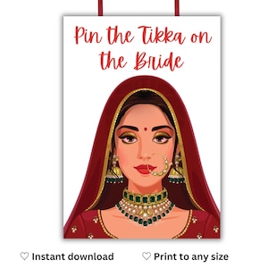 May include: A white poster with the text "Pin the Tikka on the Bride" in red. The illustration features a woman in traditional Indian attire, with a red veil, gold jewelry, and a green and gold necklace. The poster has red hanging strings.