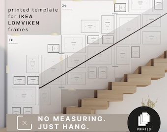 May include: A printed template for IKEA LOMVIKEN frames is displayed on a white wall. The template includes outlines of various frame sizes, with the text "NO MEASURING. JUST HANG." and "PRINTED DIN A+++." The image is of a staircase.