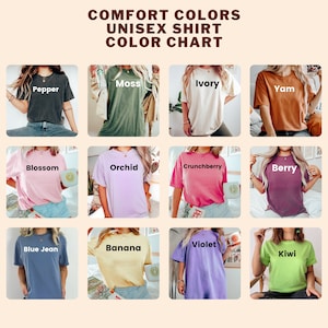 May include: Color chart showing 12 different unisex t-shirt colors. The colors are: Pepper, Moss, Ivory, Yam, Blossom, Orchid, Crunchberry, Berry, Blue Jean, Banana, Violet, and Kiwi.