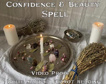 May include: A silver tray holds a lit white candle, crystals, dried flowers, and bay leaves. Two lit white candles and bundles of herbs flank the tray. Text reads "CONFIDENCE & BEAUTY SPELL" and "VIDEO PROOF".