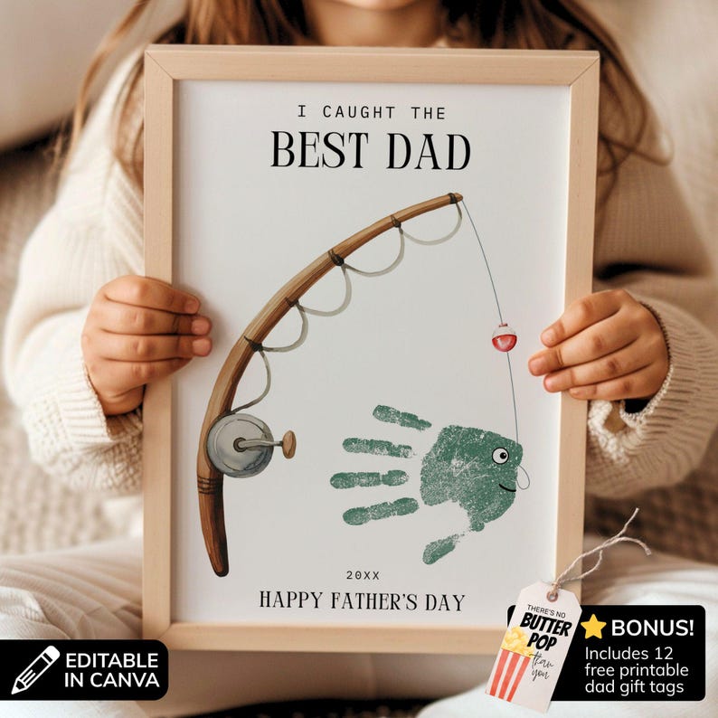 May include: A framed print featuring a brown fishing rod illustration and a green handprint shaped like a fish. The text reads I CAUGHT THE BEST DAD, 20XX, and HAPPY FATHER'S DAY. A small tag attached to the frame says THERE'S NO BUTTER POP THAN YOU.