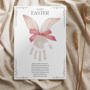 spring hand print art with watercolor bunny ears and a poem about easter