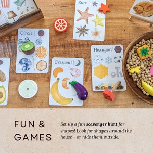May include: A set of colorful wooden shapes and cards with illustrations of different shapes. The cards have the words "Oval", "Circle", "Crescent", "Star", and "Hexagon" printed on them. The text "FUN & GAMES" is printed on a brown surface below the cards. The text "Set up a fun scavenger hunt for shapes! Look for shapes around the house - or hide them outside." is printed below the text "FUN & GAMES".