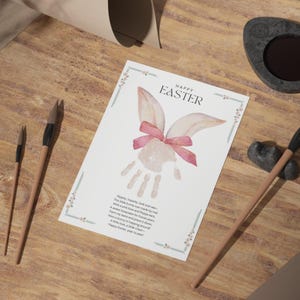 easter handprint with poem featuring easter bunny ears and a pink bow