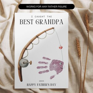 May include: A greeting card featuring a brown fishing rod illustration and a purple handprint shaped like a fish. The text reads: WORKS FOR ANY FATHER FIGURE, I CAUGHT THE BEST GRANDPA, 20XX, and HAPPY FATHER'S DAY. The design is on a white background.