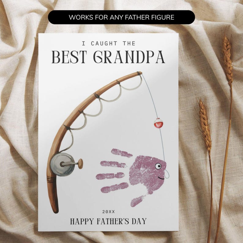 May include: A greeting card featuring a brown fishing rod illustration and a purple handprint shaped like a fish. The text reads: WORKS FOR ANY FATHER FIGURE, I CAUGHT THE BEST GRANDPA, 20XX, and HAPPY FATHER'S DAY. The design is on a white background.