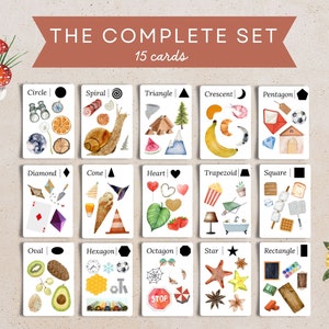 May include: A set of 15 illustrated cards featuring different geometric shapes, each with a corresponding image. The cards are white with black borders and feature a variety of colorful illustrations, including a snail, a banana, a heart, a cone, a diamond, a star, and a crescent moon. The cards are labeled with the name of the shape and a black silhouette of the shape.