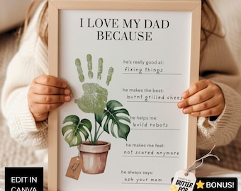 Könnte beinhalten: Ein gerahmter Druck mit dem Titel I LOVE MY DAD BECAUSE, der einen grünen Handabdruck über einer Illustration einer Topfpflanze zeigt. Der Text enthält Zeilen zum Ausfüllen von Gründen, warum man seinen Vater liebt, in einem hellen Holzrahmen.