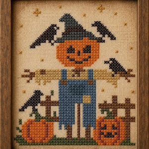 May include: A framed cross-stitch embroidery featuring a central scarecrow with an orange pumpkin head, a blue hat, and blue overalls. The scene includes three black crows, two orange jack-o'-lanterns, a wooden fence, and small yellow stars.
