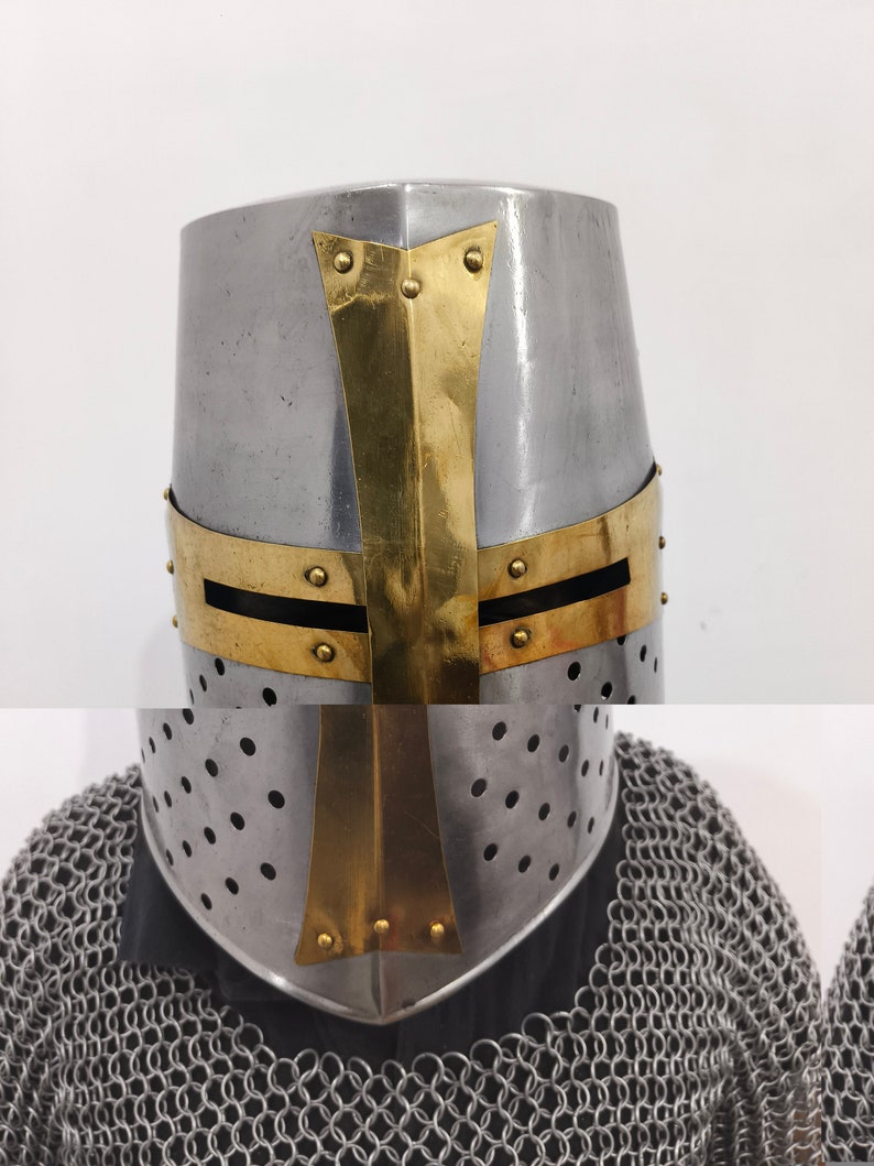 May include: A silver helmet with a gold cross design. The helmet has a pointed top and a visor with small holes.